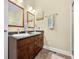 Bathroom featuring a double sink, shower with glass door, and vanity at 8503 Bean Blossom Rd, Trafalgar, IN 46181