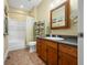 Bathroom vanity and tub with shower at 8503 Bean Blossom Rd, Trafalgar, IN 46181