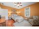 Well-lit bedroom featuring a bed, armchair, and ample natural light at 8503 Bean Blossom Rd, Trafalgar, IN 46181