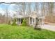 Home with a welcoming covered porch and ample greenery, creating a tranquil and inviting atmosphere at 8503 Bean Blossom Rd, Trafalgar, IN 46181
