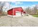 Large outbuilding with ample parking space, perfect for a workshop, garage, or storage at 8503 Bean Blossom Rd, Trafalgar, IN 46181