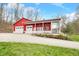 Spacious outbuilding with garage and charming porch, ideal for workshop or hobby space at 8503 Bean Blossom Rd, Trafalgar, IN 46181