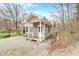 Charming home with a cozy porch and gravel driveway at 8503 Bean Blossom Rd, Trafalgar, IN 46181
