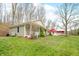 Lovely single-story home with a charming porch, set on a lush green lawn at 8503 Bean Blossom Rd, Trafalgar, IN 46181
