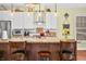 Modern kitchen with white cabinets, stainless steel appliances, and stone countertops at 8503 Bean Blossom Rd, Trafalgar, IN 46181