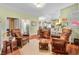 Comfortable living room featuring armchairs and a connecting view to other rooms in the home at 8503 Bean Blossom Rd, Trafalgar, IN 46181