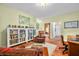 Comfortable seating area next to a bookcase that leads to another room with an attached bathroom at 8503 Bean Blossom Rd, Trafalgar, IN 46181