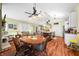 Inviting living space featuring a view of the kitchen, fireplace, dining table and ample seating at 8503 Bean Blossom Rd, Trafalgar, IN 46181