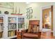 Inviting living room boasts a cozy chair and bookcase at 8503 Bean Blossom Rd, Trafalgar, IN 46181