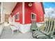 Inviting porch with seating, perfect for relaxation and enjoying the tranquil outdoor setting at 8503 Bean Blossom Rd, Trafalgar, IN 46181