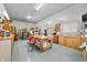 Spacious workshop with built-in cabinets, lighting, and a large workbench at 8503 Bean Blossom Rd, Trafalgar, IN 46181