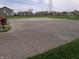 Community basketball court perfect for neighborhood games with a playground and grassy area at 8801 Twain Ln, Indianapolis, IN 46239