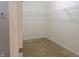 A walk in closet with carpet flooring and shelving for storage and organization at 8801 Twain Ln, Indianapolis, IN 46239