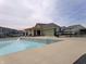 Community pool with clear blue water, a spacious deck, and comfortable lounge chairs for relaxation at 8801 Twain Ln, Indianapolis, IN 46239