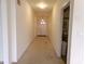 Well-lit hallway with access to multiple rooms and a view to the front door at 8801 Twain Ln, Indianapolis, IN 46239