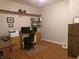 Functional home office with hardwood floors, built-in shelving, and natural lighting at 8801 Twain Ln, Indianapolis, IN 46239