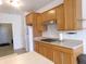 Bright kitchen with wood cabinets, stainless steel appliances, and modern countertops at 8801 Twain Ln, Indianapolis, IN 46239