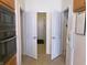 The kitchen features stainless steel appliances and neutral color scheme at 8801 Twain Ln, Indianapolis, IN 46239