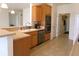 Bright kitchen with wood cabinets, stainless steel appliances, and modern countertops at 8801 Twain Ln, Indianapolis, IN 46239