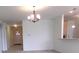 Open concept living space with hardwood floors and modern lighting at 8801 Twain Ln, Indianapolis, IN 46239