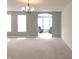 Spacious living room with abundant natural light and an entryway to the sun room at 8801 Twain Ln, Indianapolis, IN 46239