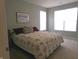 Comfortable main bedroom with bright windows and a view at 8801 Twain Ln, Indianapolis, IN 46239