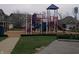 Community playground with climbing structures, slides, and swings, promoting active outdoor play at 8801 Twain Ln, Indianapolis, IN 46239