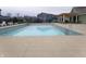 A community pool, loungers, and an adjacent pergola sit behind residential homes and a playground at 8801 Twain Ln, Indianapolis, IN 46239