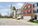 Townhomes with brick and siding exteriors, attached garages, landscaping, and private driveways at 9010 Ramapo Dr, Fishers, IN 46038