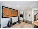 Finished basement has exercise equipment and a large, framed Mickey Mouse display for character at 9010 Ramapo Dr, Fishers, IN 46038