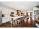 Bright kitchen with stainless appliances, a large center island, and views to the living area at 9010 Ramapo Dr, Fishers, IN 46038