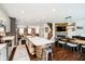 Open-concept kitchen with a large island, stainless appliances, and hardwood floors at 9010 Ramapo Dr, Fishers, IN 46038