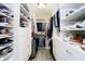 Walk-in closet with custom shelving, rods, and drawers, offering ample storage space at 9010 Ramapo Dr, Fishers, IN 46038