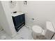Powder room featuring a modern vanity and toilet at 905 W 3Rd St, Anderson, IN 46016