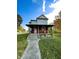 Charming two-story home with a welcoming front porch and well-maintained lawn, perfect for enjoying outdoor living at 905 W 3Rd St, Anderson, IN 46016