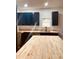 Modern kitchen features butcher block countertops, dark blue cabinets and ample natural light at 905 W 3Rd St, Anderson, IN 46016