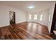 Bright living room features sleek hardwood floors and a large bay window, creating a comfortable space at 905 W 3Rd St, Anderson, IN 46016