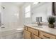 Bathroom featuring a shower-tub combo and a light wood vanity at 9338 Eden Woods Ct, Indianapolis, IN 46260