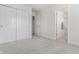 Carpeted bedroom featuring closets and doorway to bathroom at 9338 Eden Woods Ct, Indianapolis, IN 46260