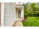 Side entrance with a decorative wreath and landscaped walkway to the front door at 9338 Eden Woods Ct, Indianapolis, IN 46260