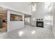 Open-concept living room with a fireplace and abundant natural light at 9338 Eden Woods Ct, Indianapolis, IN 46260