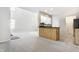 Open living room with neutral walls and plush carpet, with kitchen counter at 9338 Eden Woods Ct, Indianapolis, IN 46260