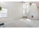 Spacious living room featuring high ceilings, neutral paint, and large windows at 9338 Eden Woods Ct, Indianapolis, IN 46260