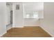 Bright room with hardwood floors, a window, and neutral walls and carpet nearby at 9338 Eden Woods Ct, Indianapolis, IN 46260