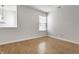 Bright room with hardwood floors, a window, neutral walls, and plenty of natural light at 9338 Eden Woods Ct, Indianapolis, IN 46260