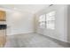 Bright room with neutral walls, plush carpet, and a window providing natural light at 9338 Eden Woods Ct, Indianapolis, IN 46260