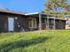 Brick home with covered patio and large grassy backyard, perfect for outdoor entertaining at 935 Fry Rd, Greenwood, IN 46142