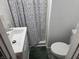 Compact bathroom features a toilet, sink and a shower with a stylish curtain at 935 Fry Rd, Greenwood, IN 46142