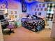 Eclectic bedroom with colorful decor, a desk, and a playful vibe at 935 Fry Rd, Greenwood, IN 46142