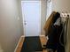 Functional entryway with a coat rack, door and neutral paint color at 935 Fry Rd, Greenwood, IN 46142